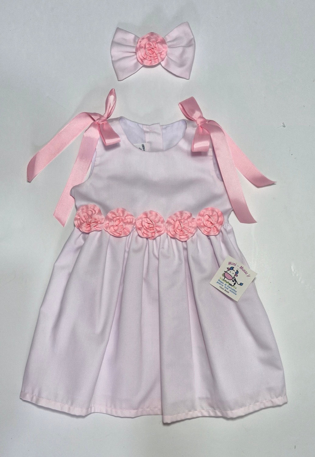 Vest rosado flores y moñas de liston