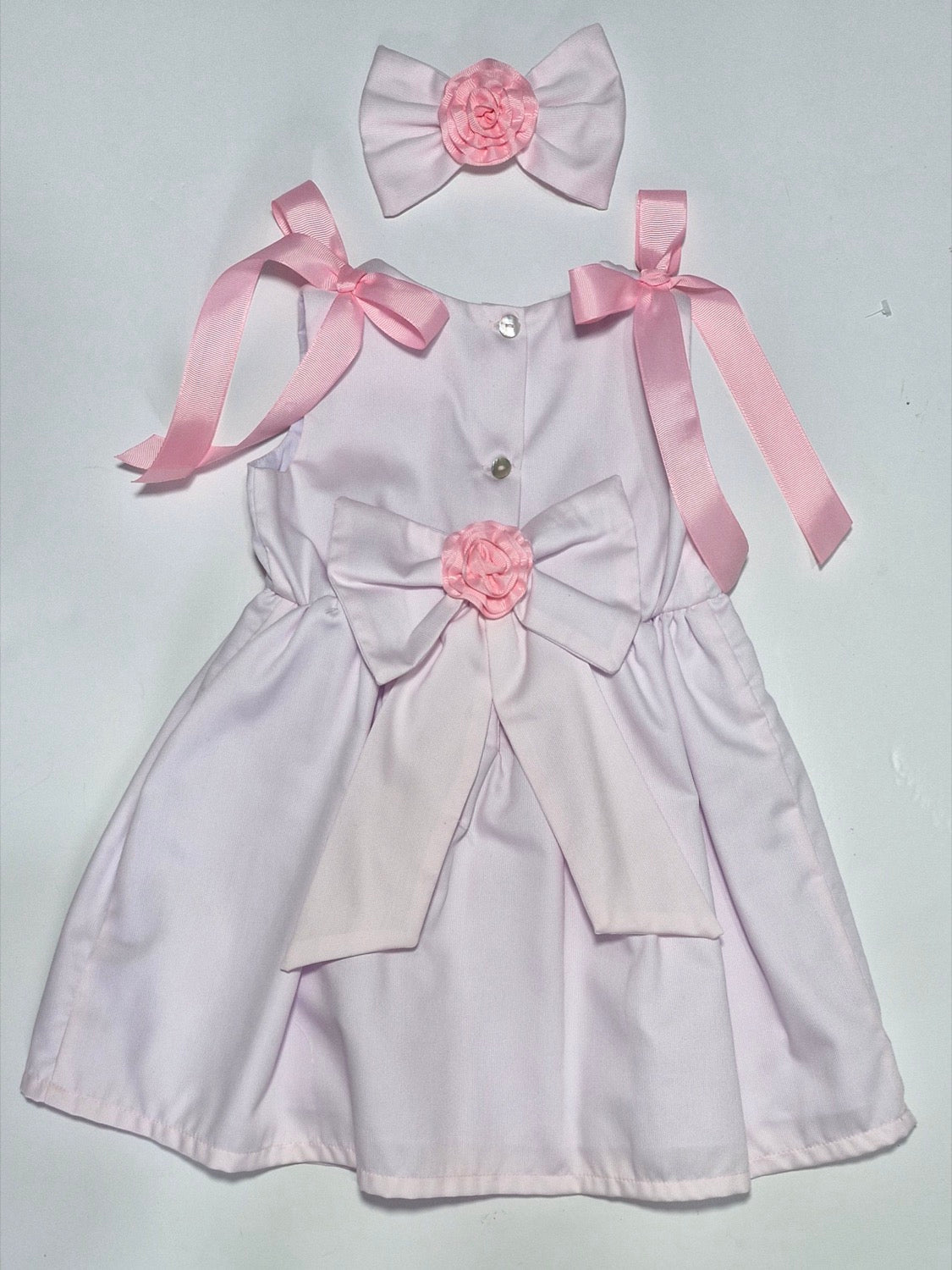 Vest rosado flores y moñas de liston